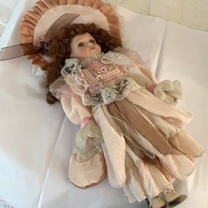 Porcelain doll on stand